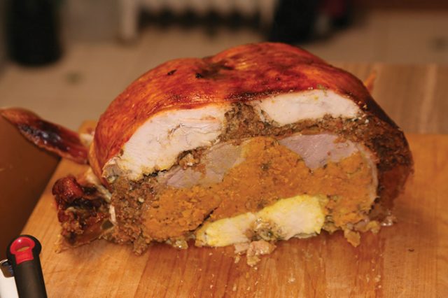 A turducken consists of a chicken stuffed in a duck stuffed in a turkey and often features traditional autumnal sides, like stuffing or sweet potatoes, between the poultry. -- photo by Nate Vack